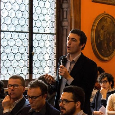 A young man speaks during a debate at a cultural event organized by the Jesuits